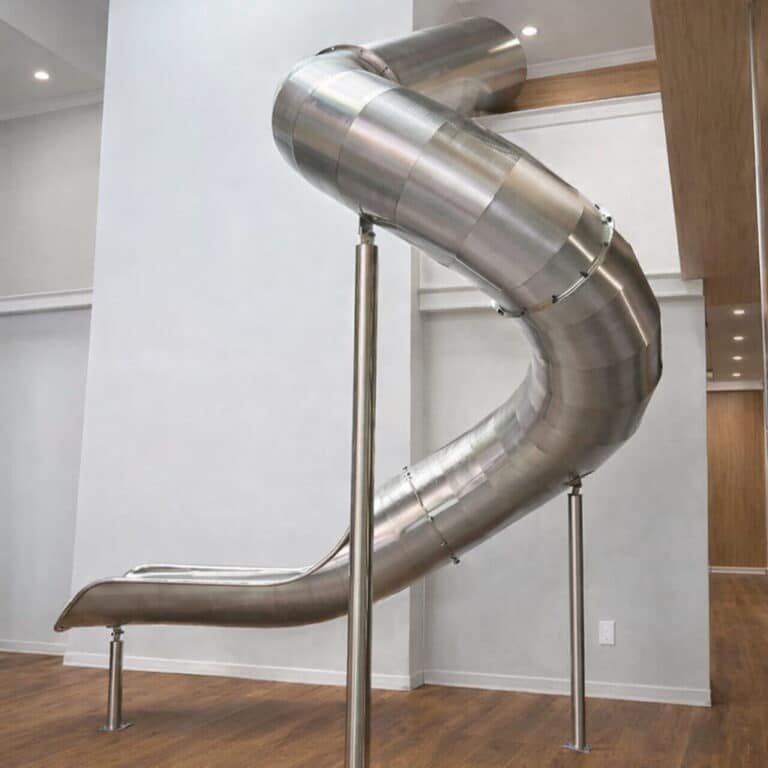 Landrec stainless steel spiral tunnel slide mounted on support posts